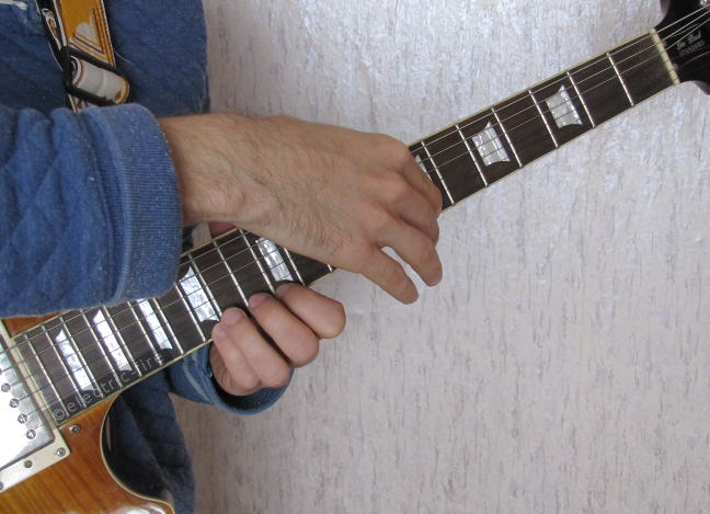 Performing Guitar Cross Tapping